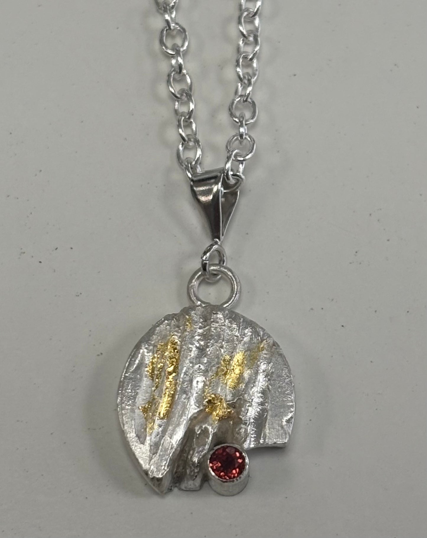Sterling silver & 24ct gold pendant with garnet