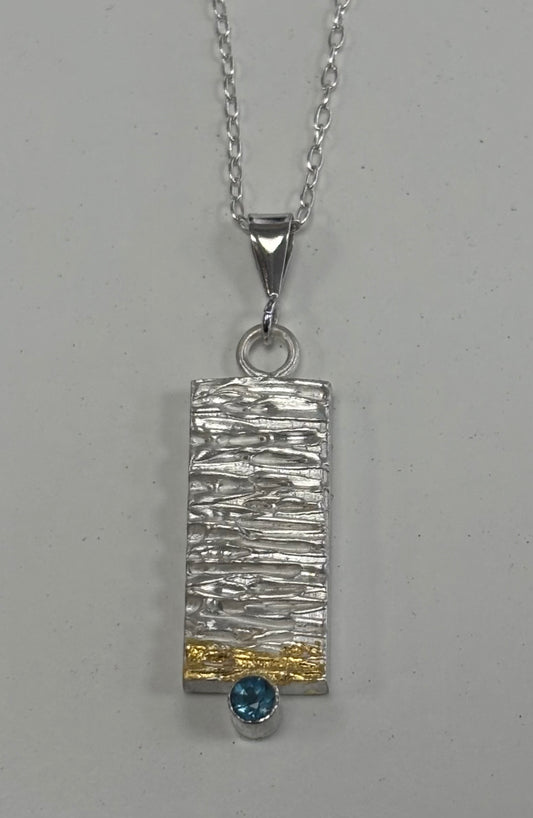 Sterling silver & 24ct gold pendant.